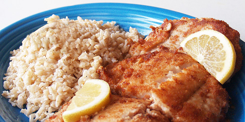 Gluten Free Coconut Fried Fish with Organic Brown Rice and Lemon Wedges. Prepared by Sarah Shilhavy. Photo by Jeremiah Shilhavy, all copyrights reserved.